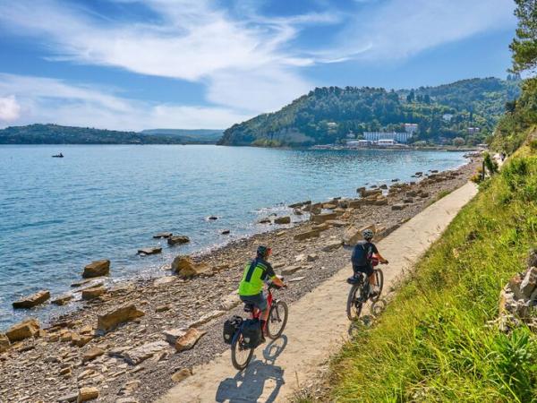 cyclists along the adriatic cost near Koper