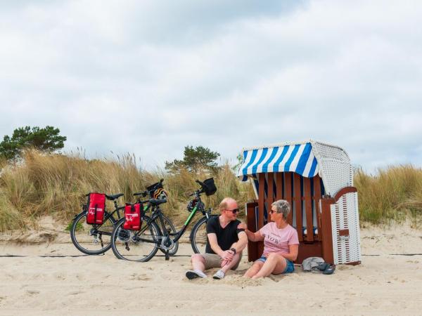 Cyclists taking a beach break