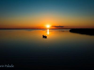 Sunset with a little fishing boat