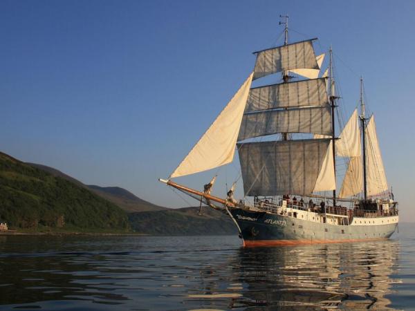 sail ship Atlantis during sunset