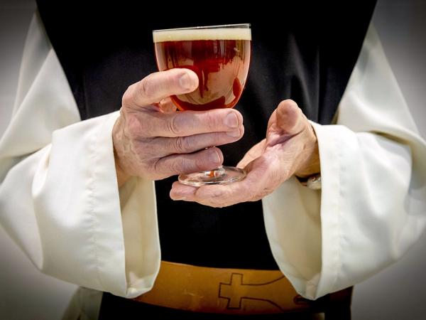 monk with trappist beer in Zundert